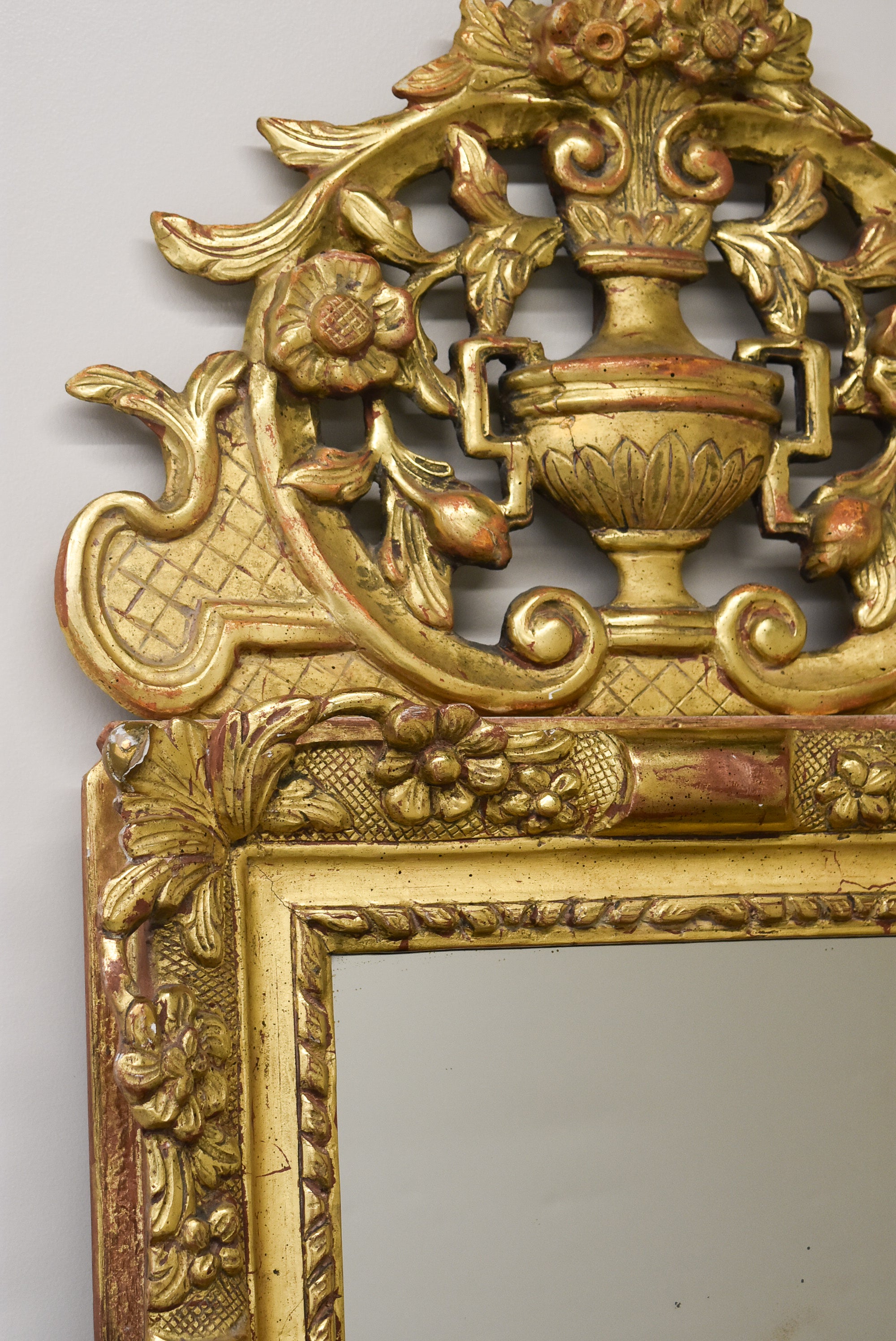 Early 18th Century French Giltwood Mirror with Fronton